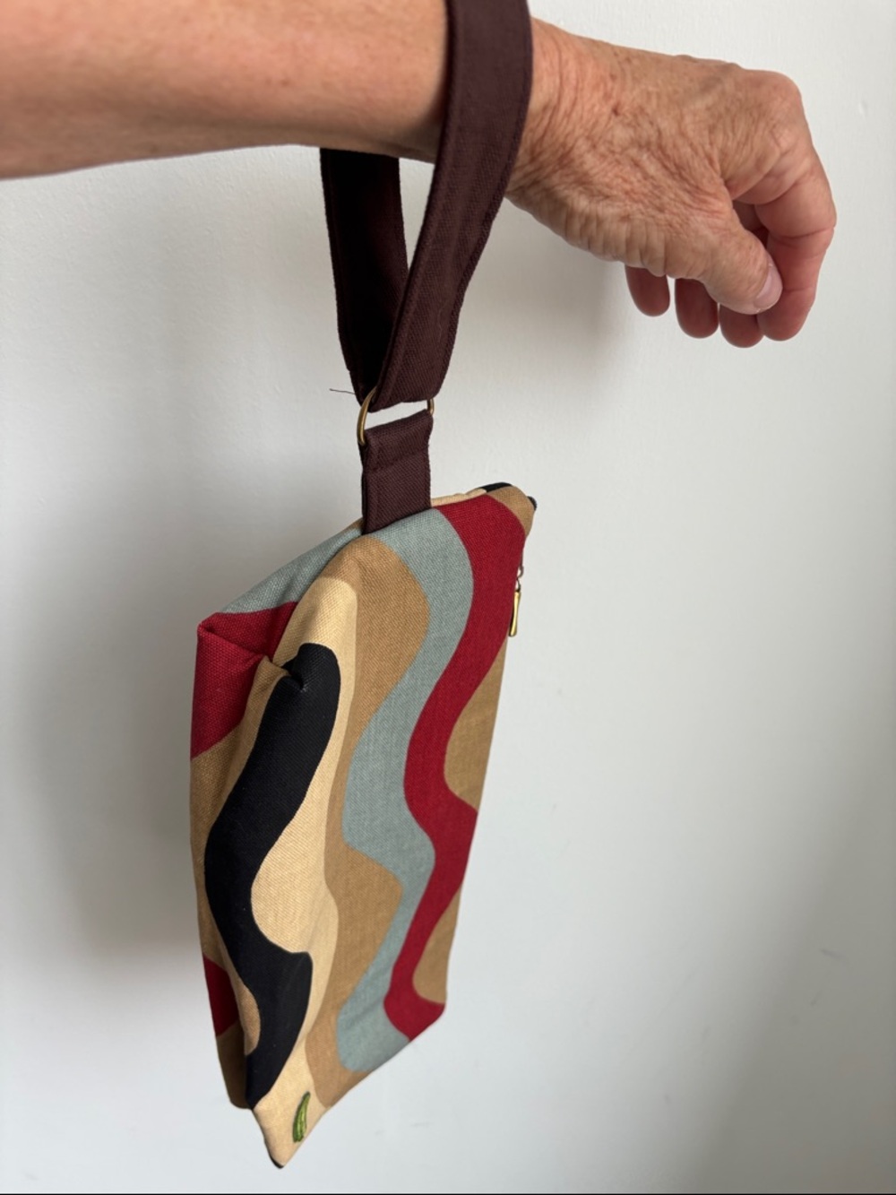 Viv Pickle Canvas wristlet bag,wavy design, tan/red/blue, interior pocket, 13x6”
